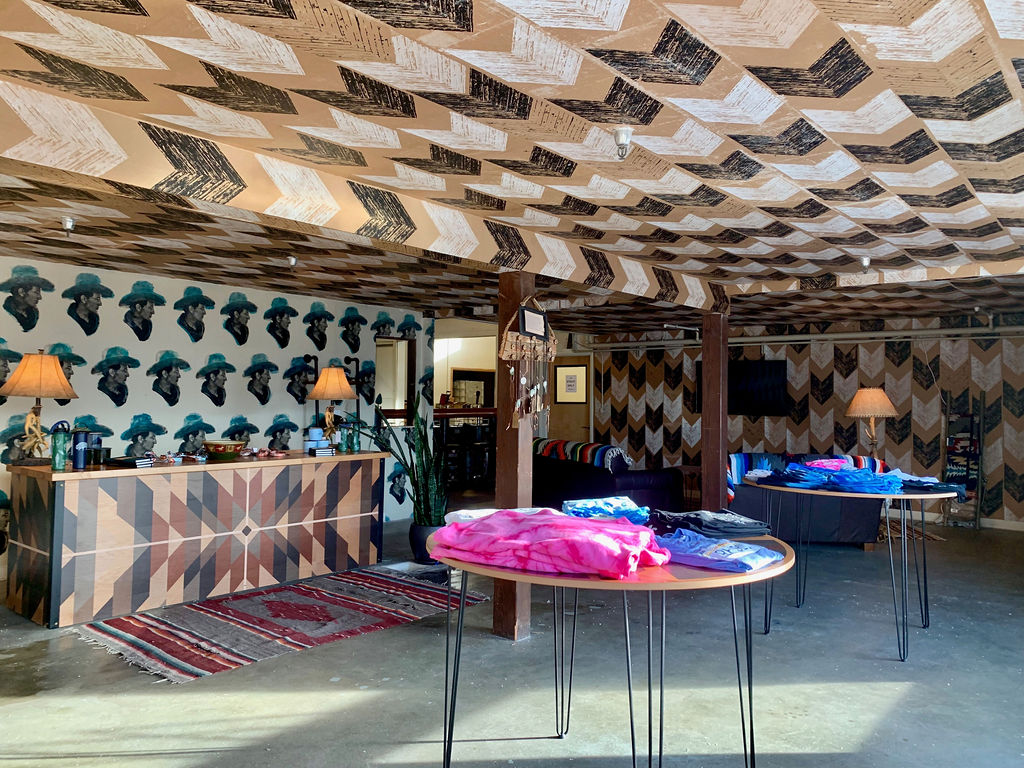 Western Collective, finished retail lounge with chevron ceiling and southwestern design.